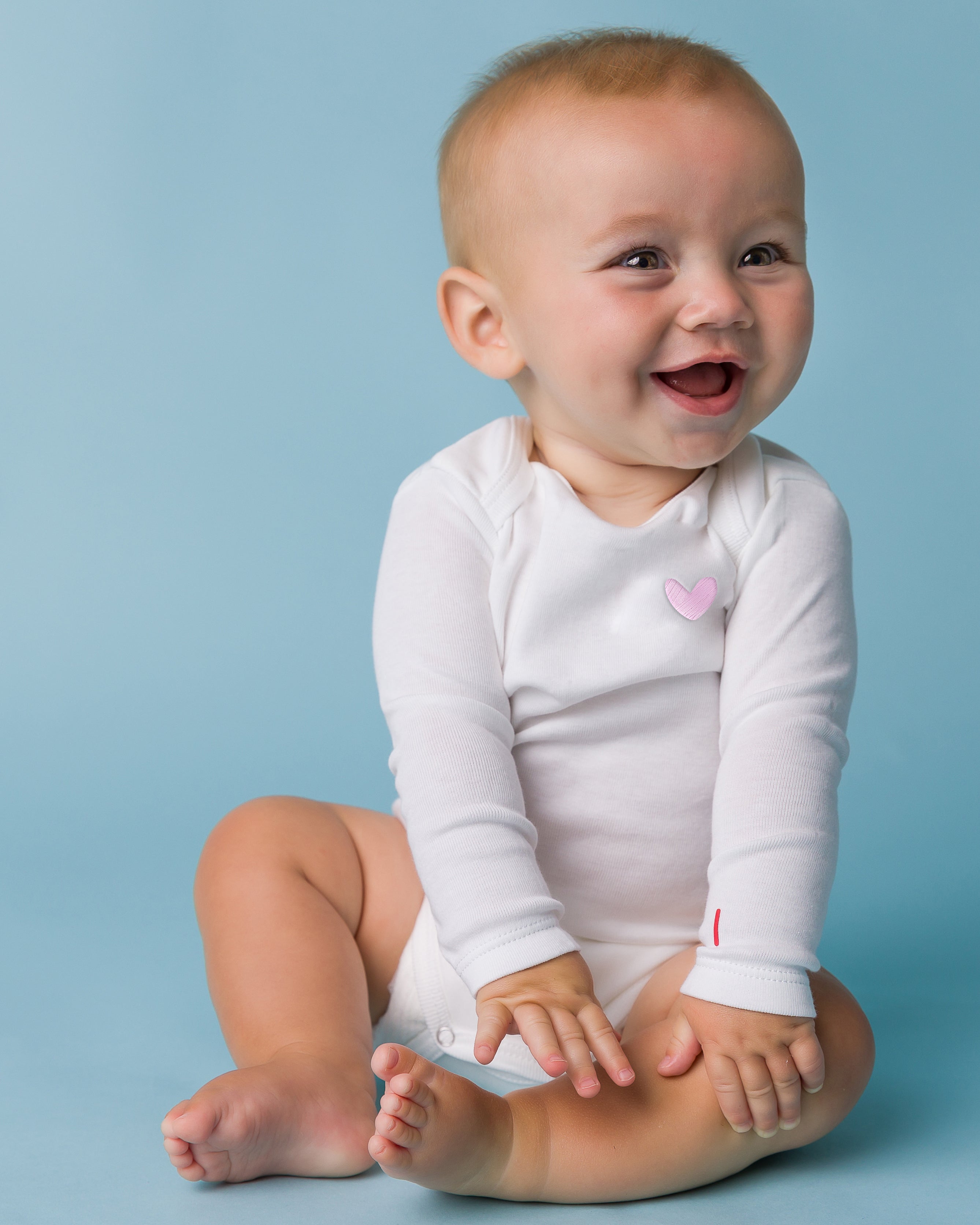 The Organic Embroidered Long Sleeve Onesie [White with Pink Heart]